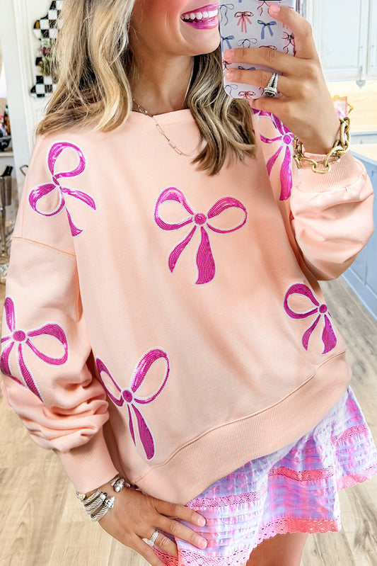 Apricot Pink Sequin Bow Drop Shoulder Oversized Sweatshirt - Thirty-One Boutique, LLC